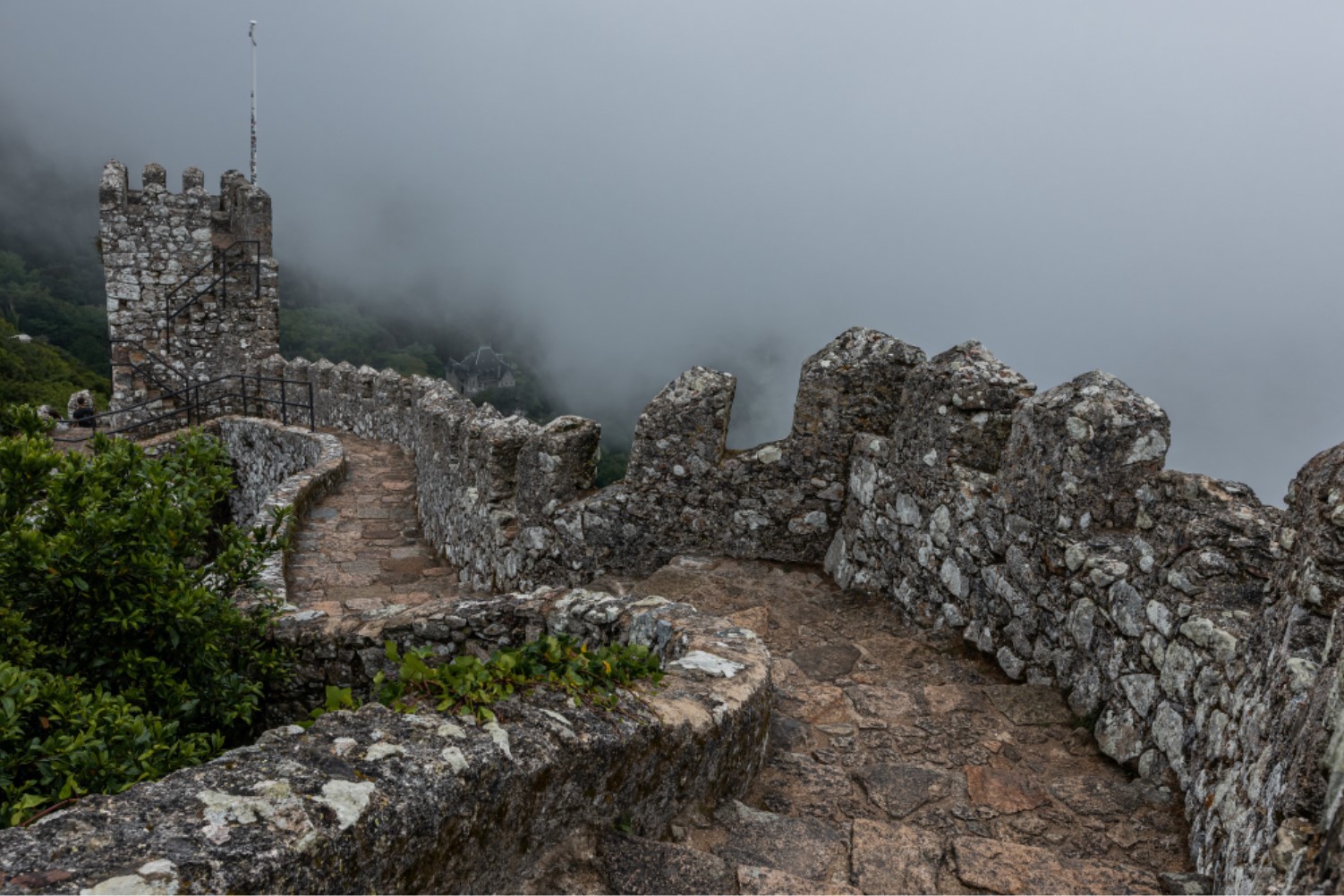 Stone small path found at an ancient site flanked by stone walls
