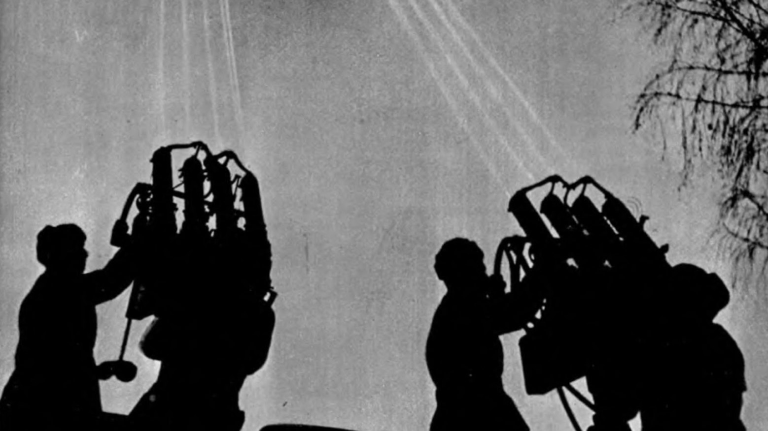 Silhouette of people working the air defense systems in the Nizhny Novgorod Kremlin during World War II.