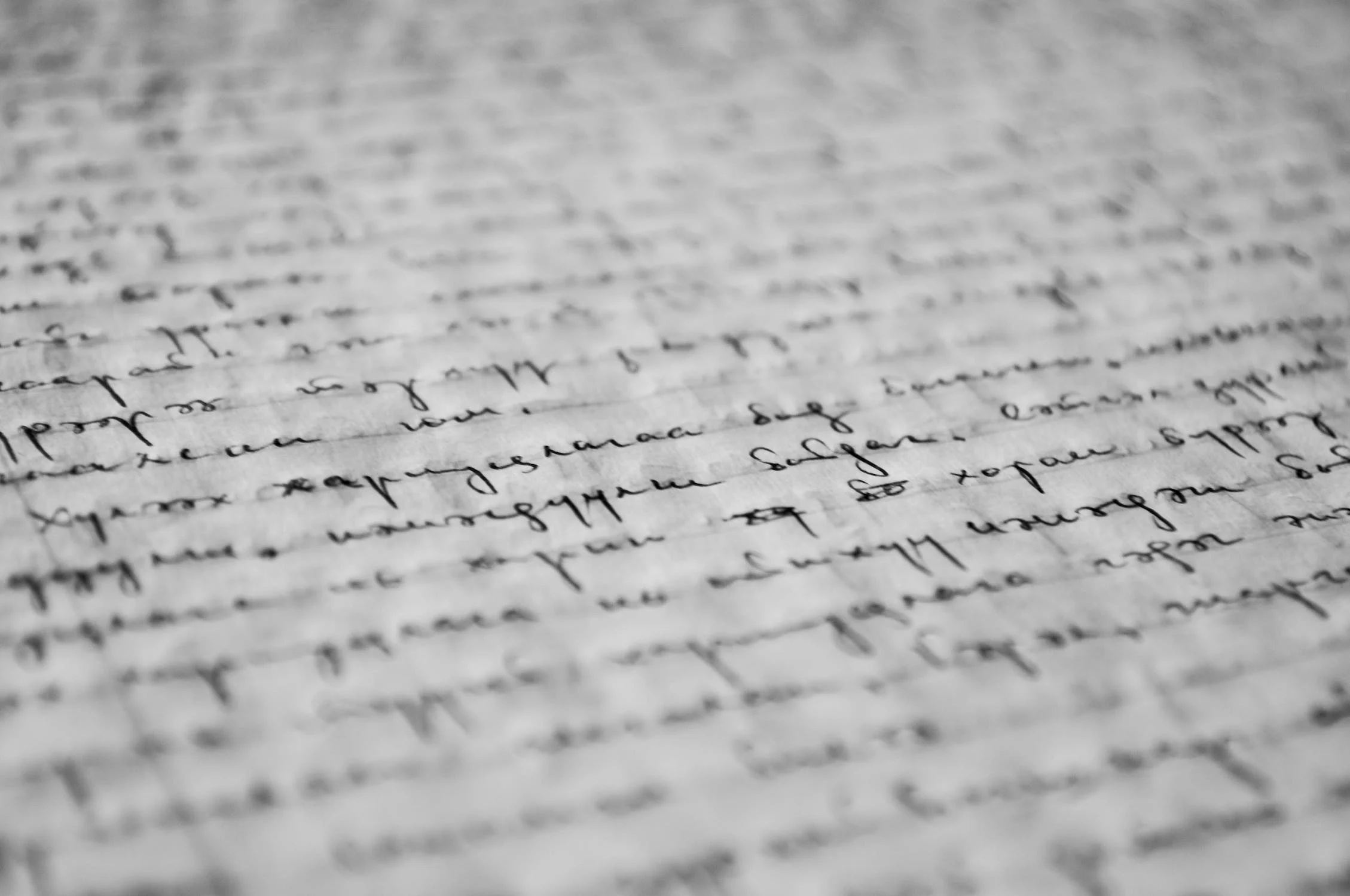A close-up of written text on a white piece of paper