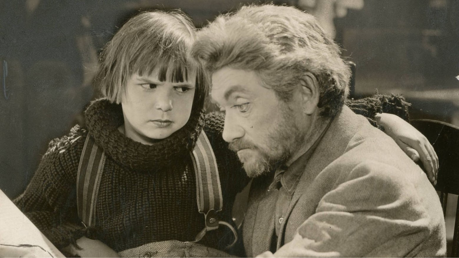 Child actor Jackie Coogan with an adult actor in movie still from 1925’s “The Rag Man.”