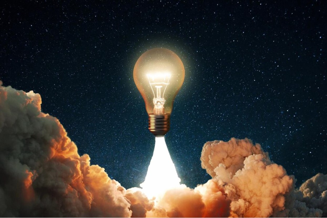 Illustration of an idea through a lit lightbulb emerging from a cloud of smoke