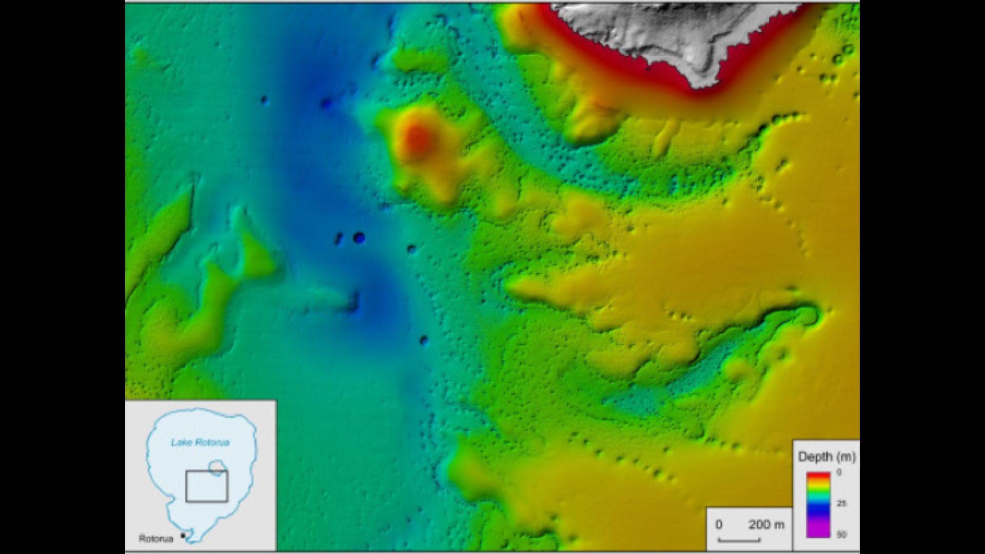 Bathymetric map reveals thousands of pockmarks from gas discharge on the lake bed and evidence of a sweeping paleo river (deeper blue) that existed before the lake's formation