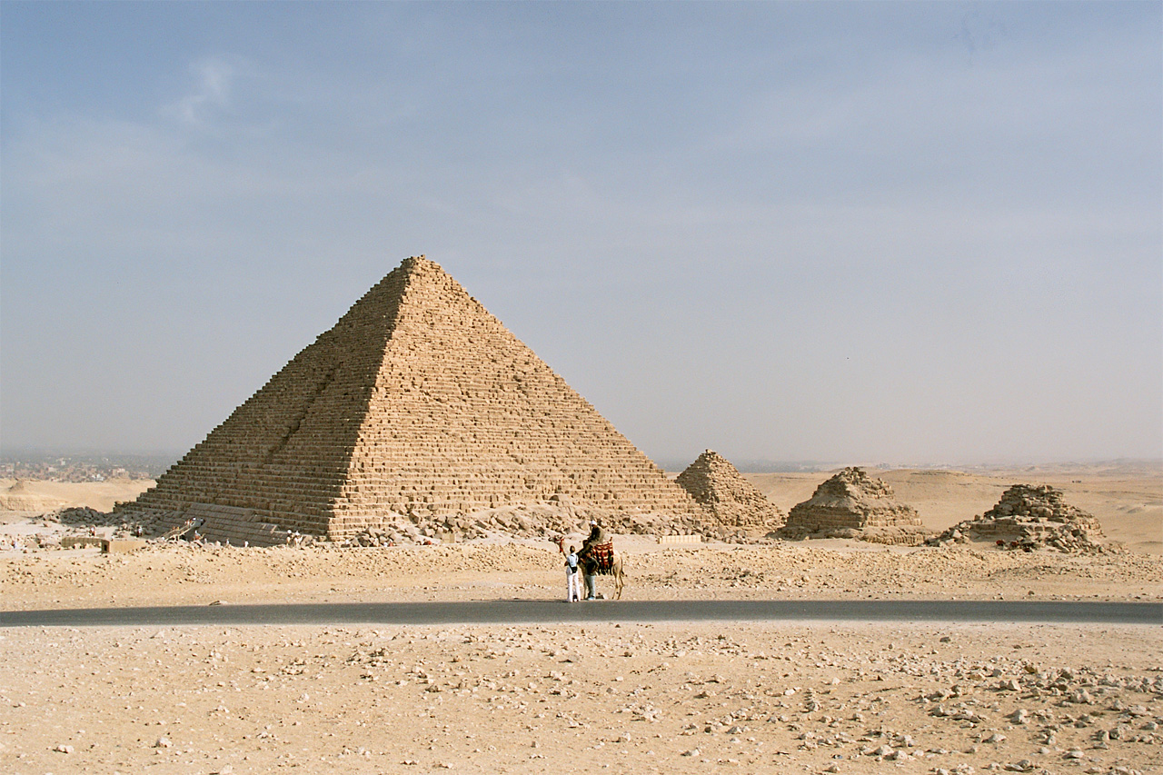 The Pyramid of Menkaure with a person on a camel in front of it