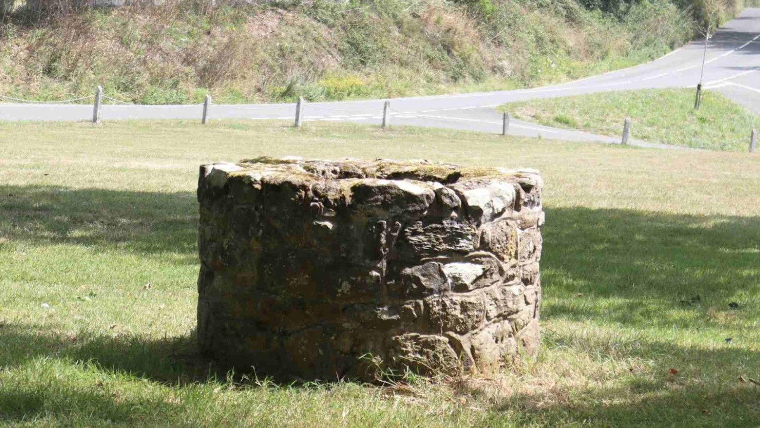A well next to a country road