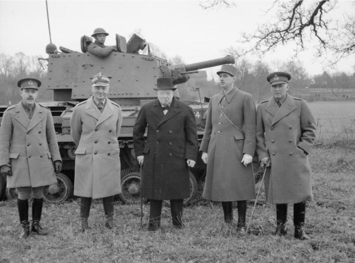 Prime Minister Winston Churchill poses with ally leaders in front of a tank