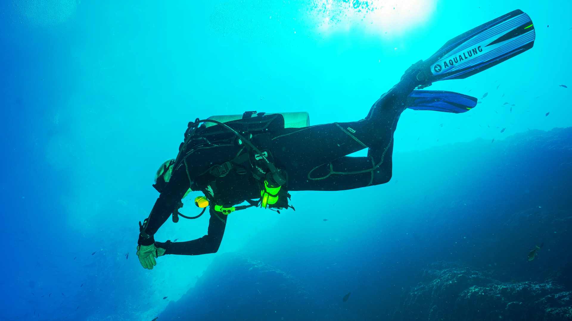 A diver exploring an area undewater.