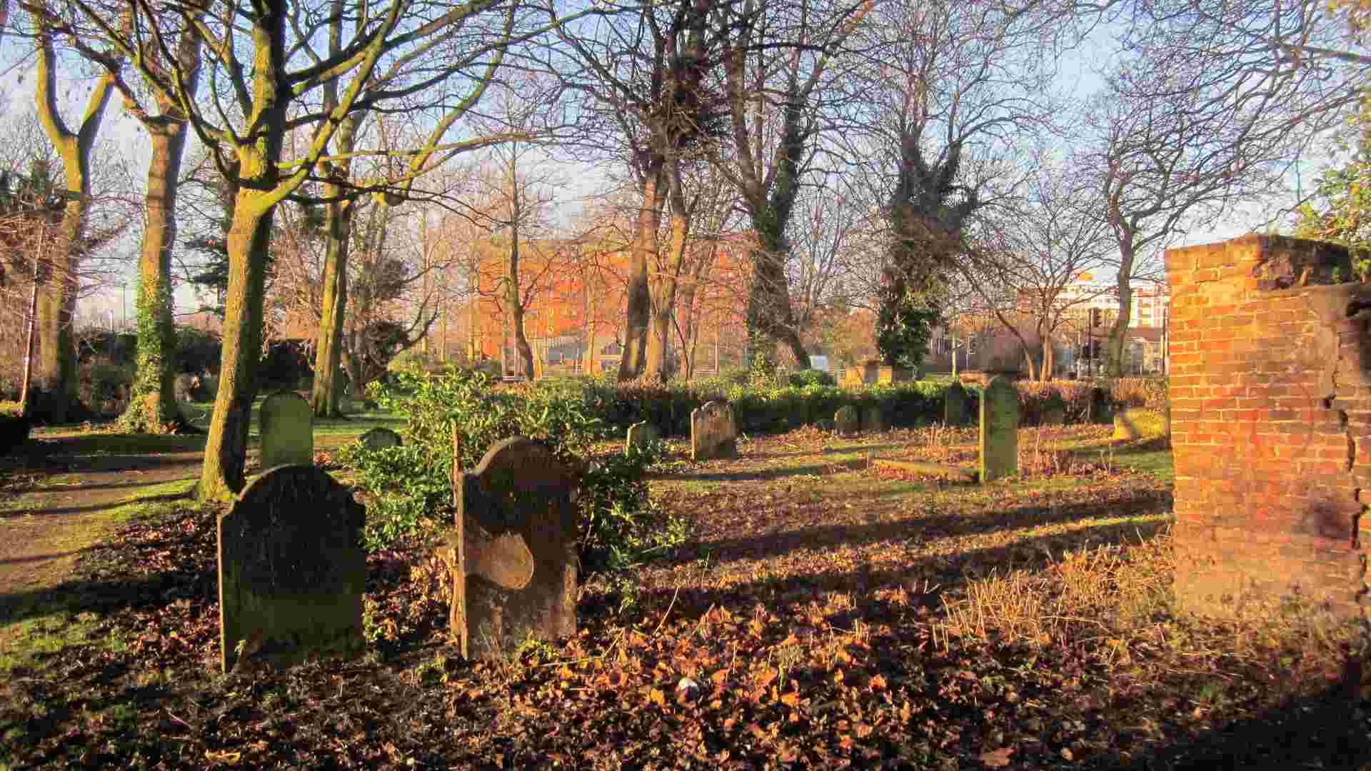 A burial ground filled with headstones and graves.