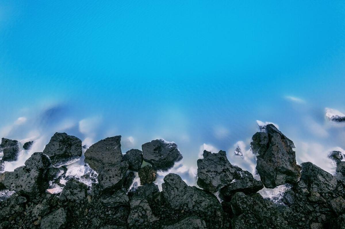 Water crashes along volcanic rocks