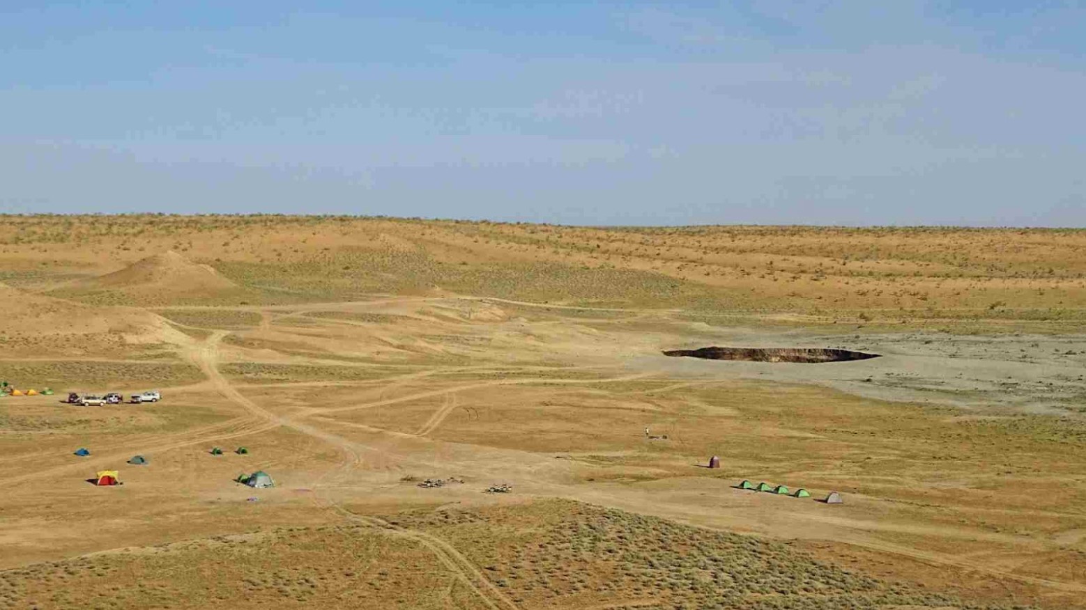 People camping near the gas crater in the Karakum desert.