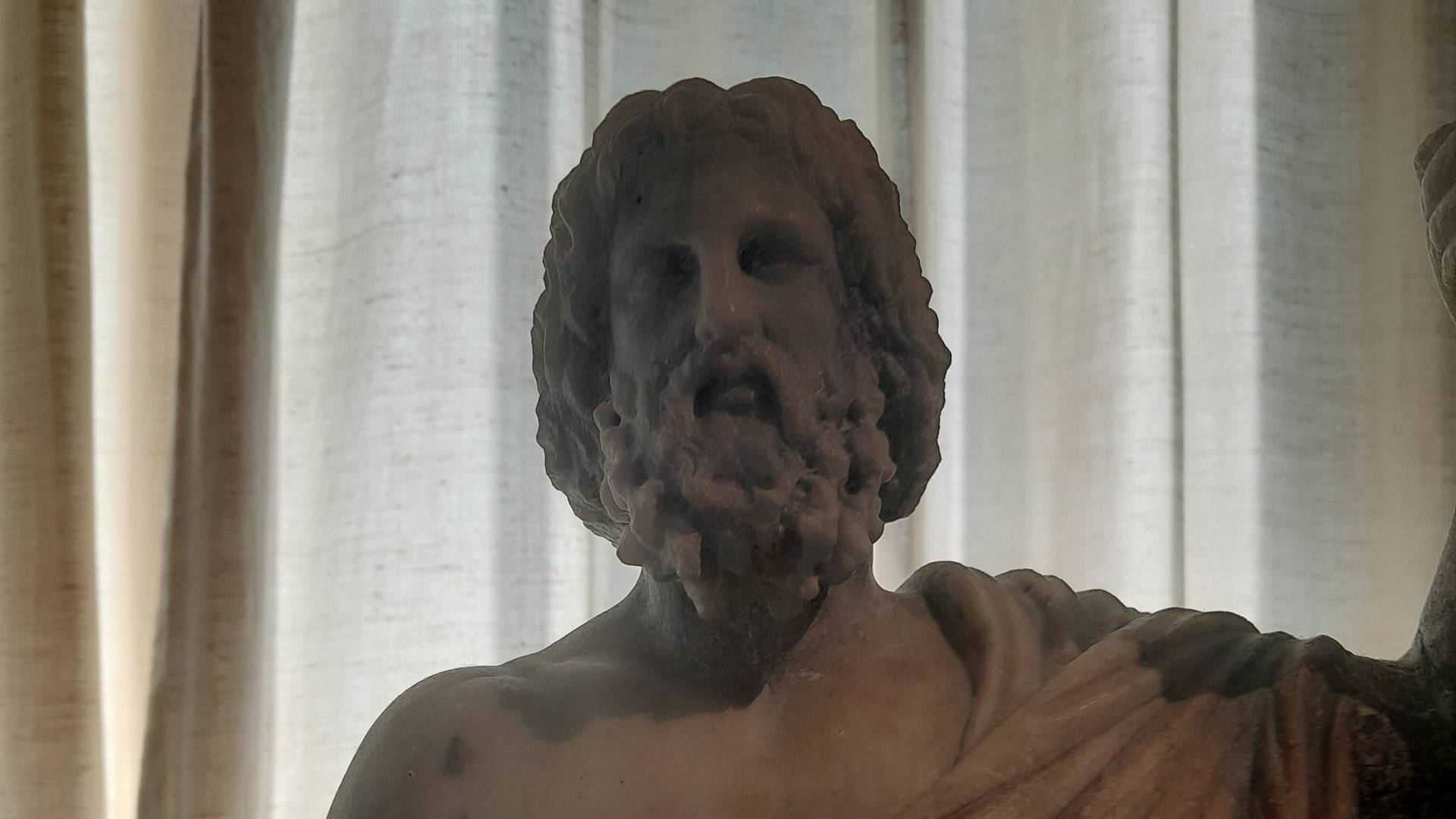 A statue of the Greek God Zeus.