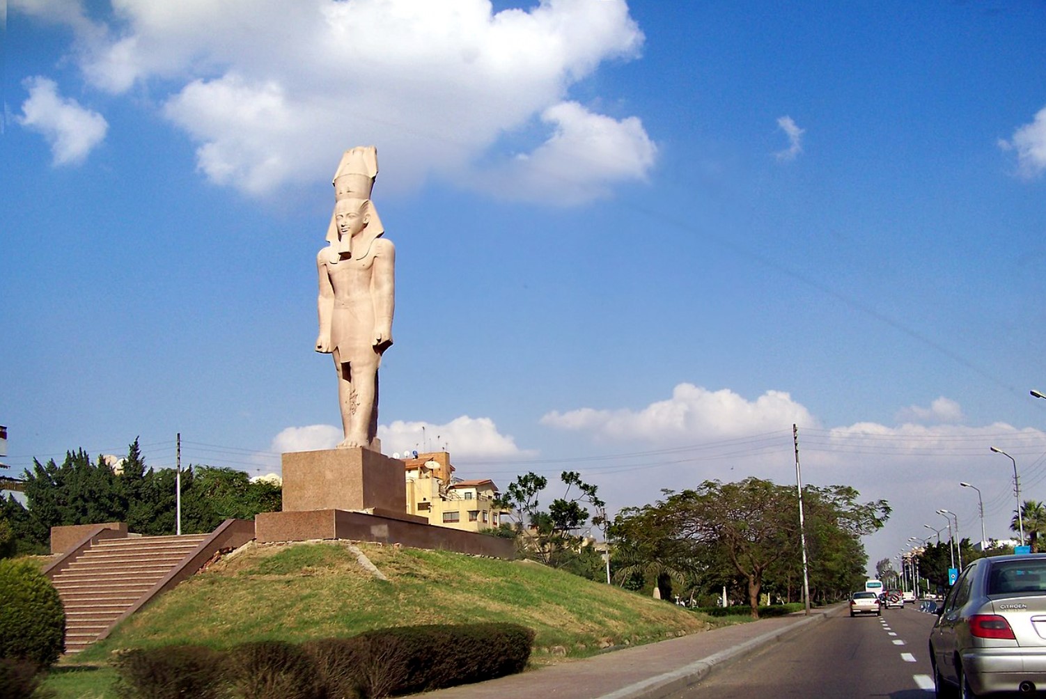 A replica of a large Ramses II statue is pictured beside a main road in Cairo