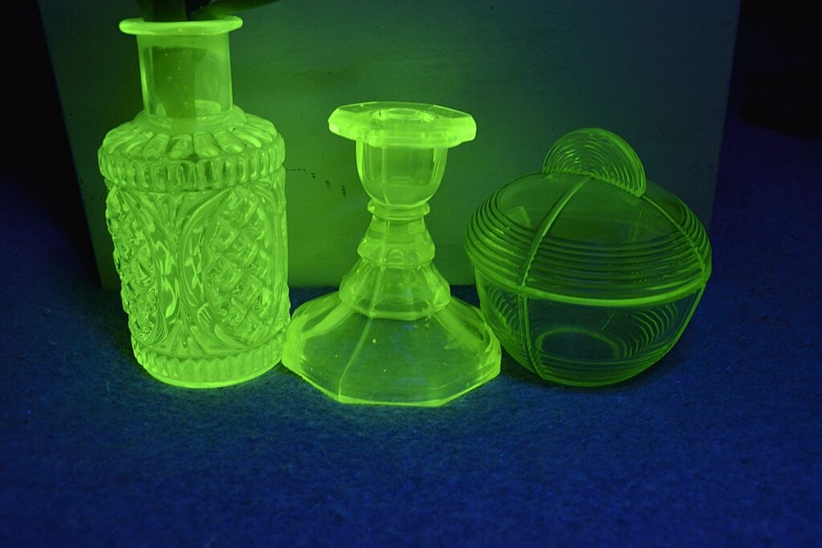 An image of three glass items made using uranium colouring