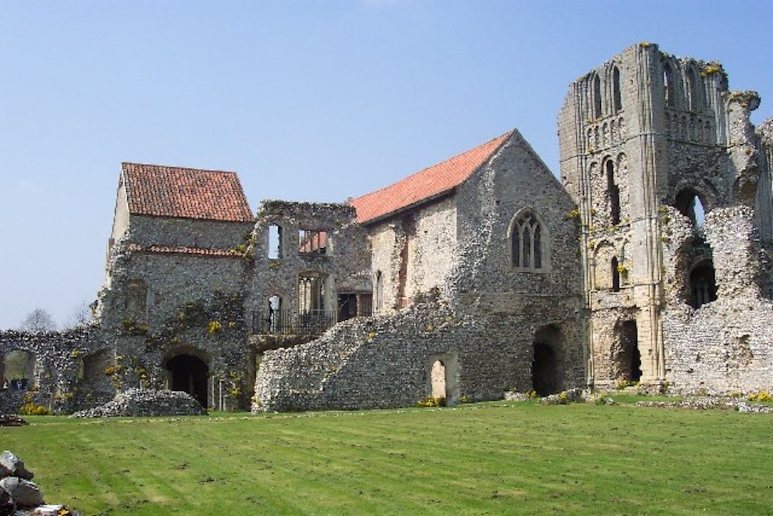 A wide shot of an old stone castle on a sunny day in England