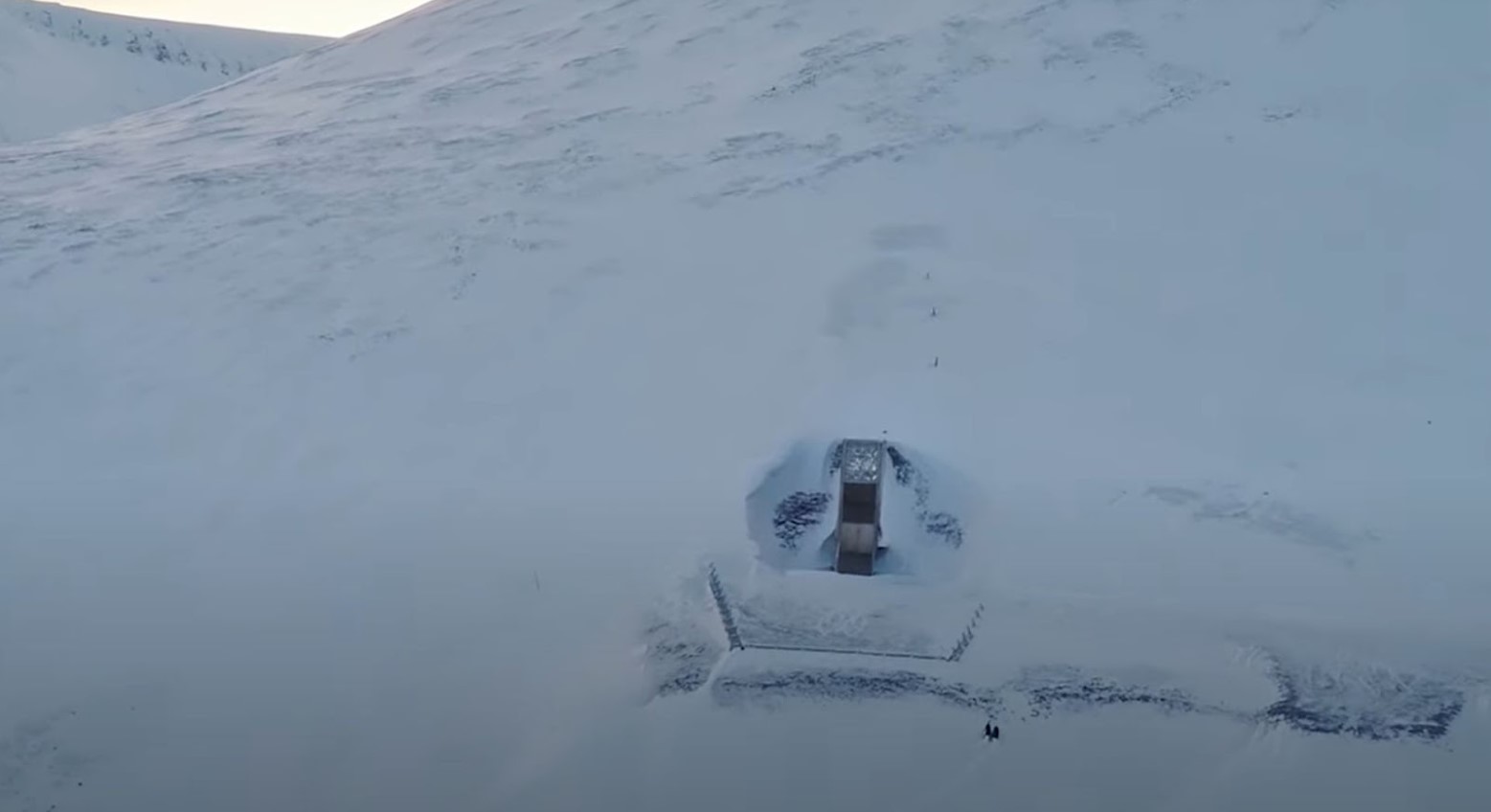 The seed vault that has been surrounded by snow.