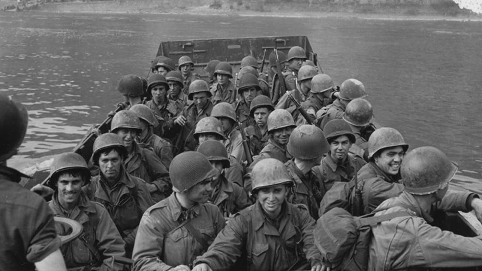 Many American soldiers crossing the Rhine River in Germany during World War II.