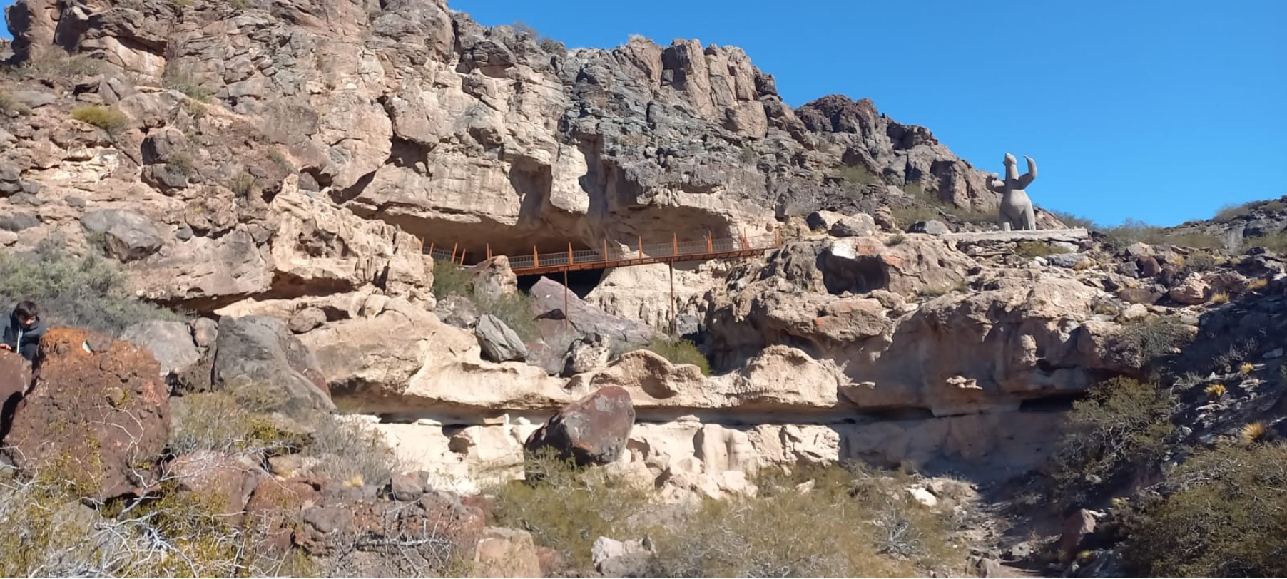 A photograph of the exterior of the Cueva Huenul site