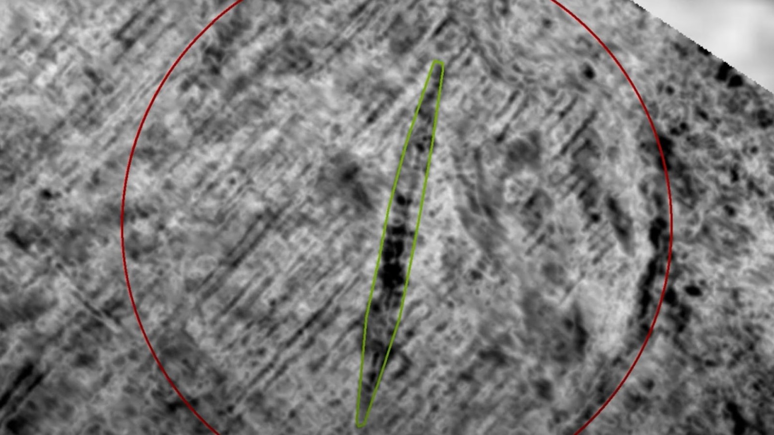 A satellite image of the Viking ship that is under the sea in Norway. Most of the picture is grey but there is a red circle showing where the ship is and a thin line circled in green which is the Viking ship.