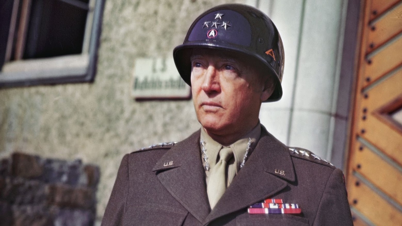 A colorized portrait photograph of George S. Patton during WWII.