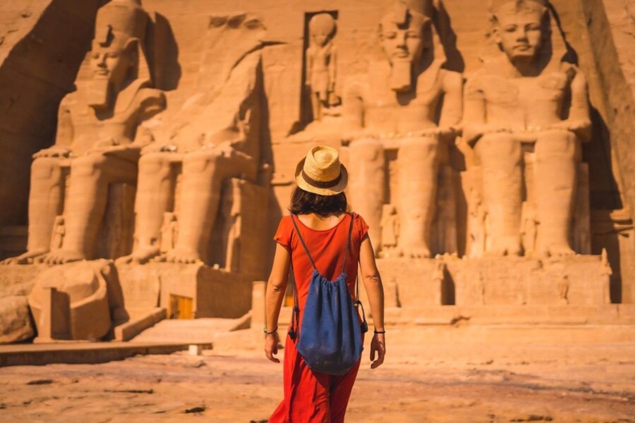 A modern-day woman admiring the statues of Ancient Egypt