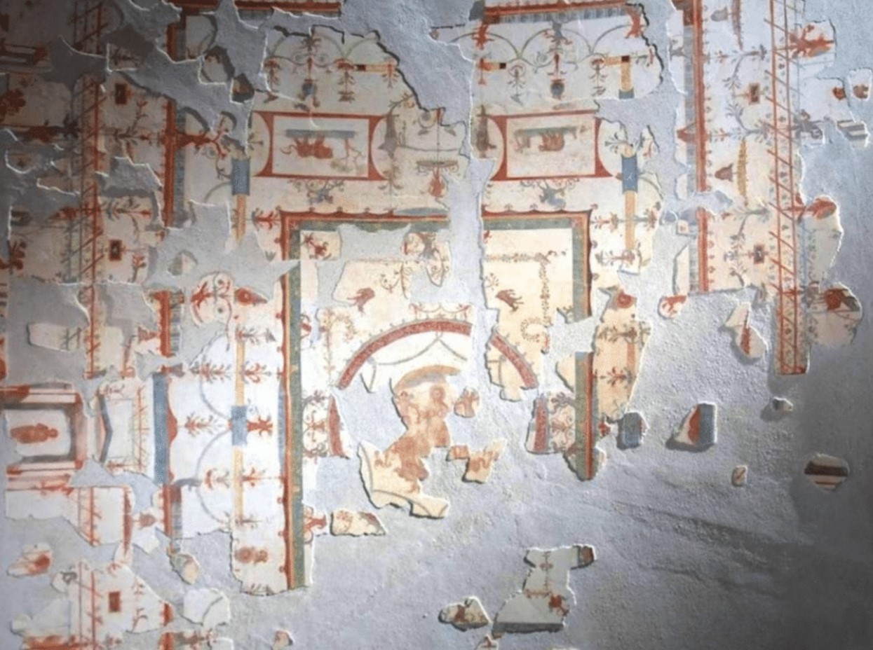 Pieces of a mural found in the ancient city of Pompeii laid out to form an image