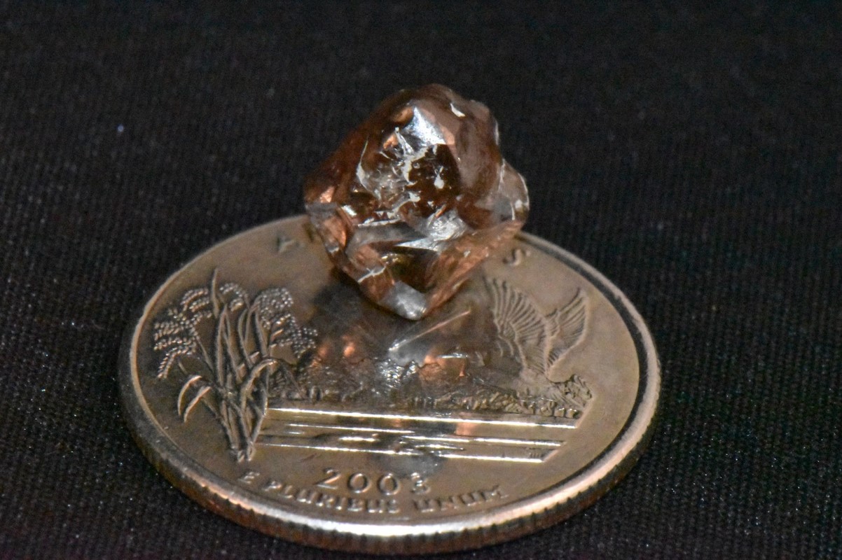 Navas’ diamond is compared against a metal coin
