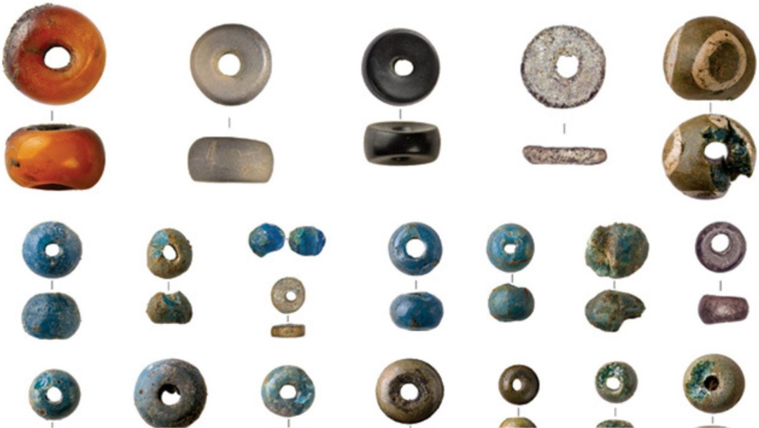 A selection of beads found at Must Farm, including glass, amber, siltstone, and shale