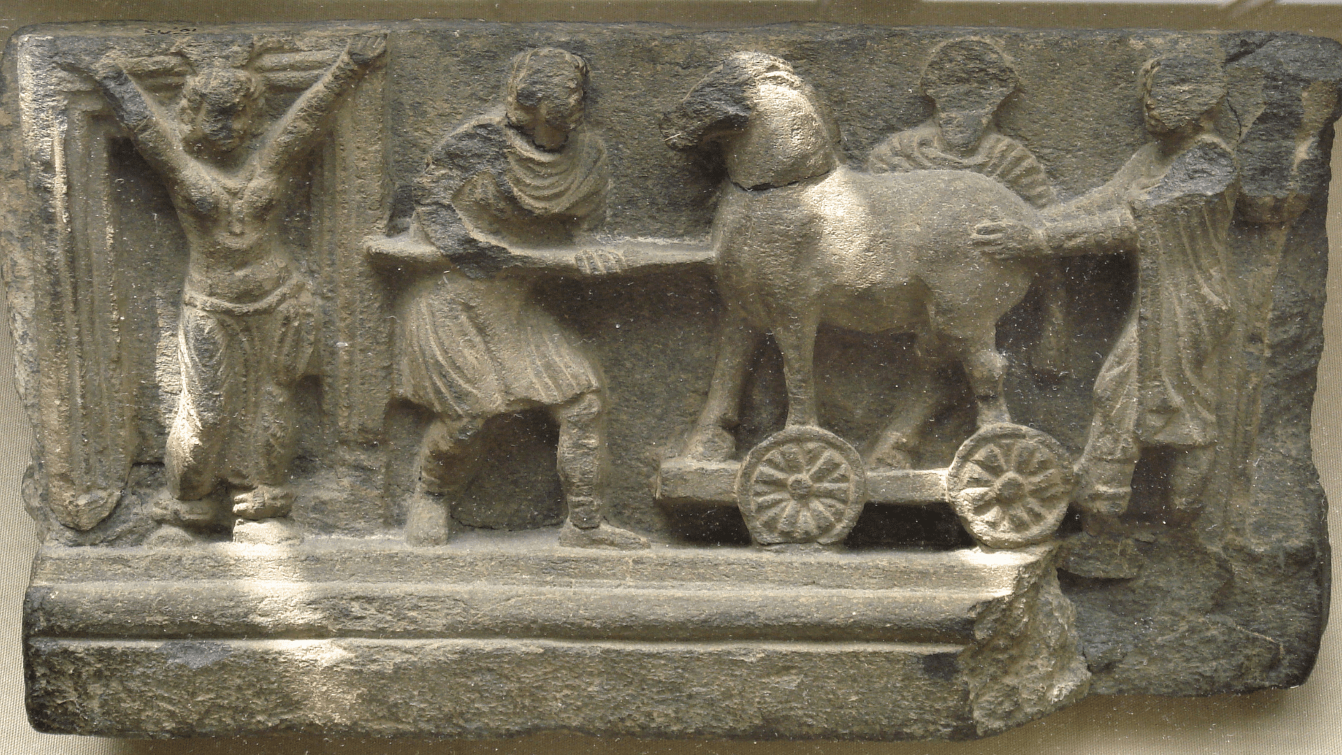 Depiction of the story of the Trojan horse in a frieze created by the Gandhara civilization.