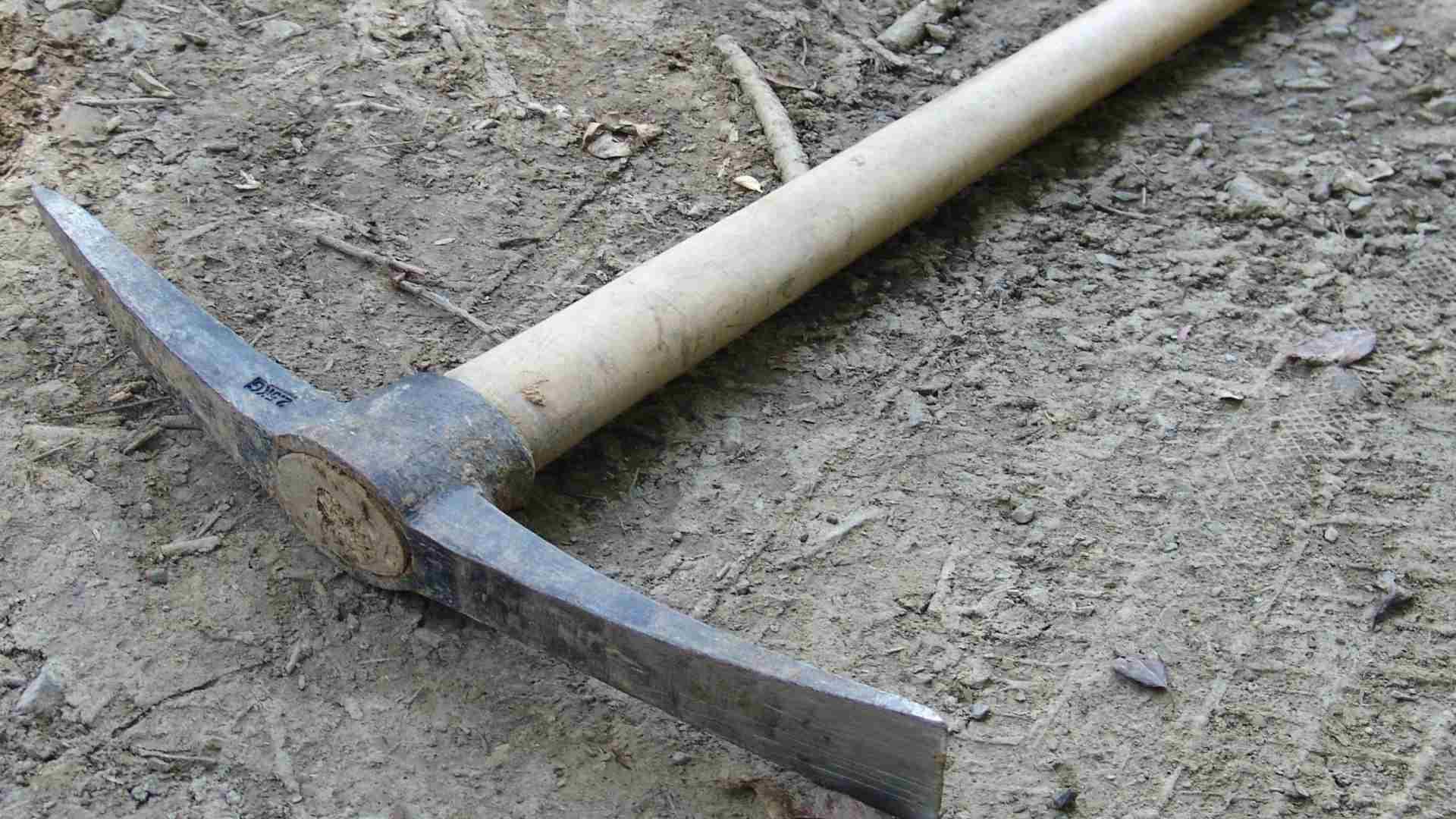 A pickaxe used for mining lying on the ground.