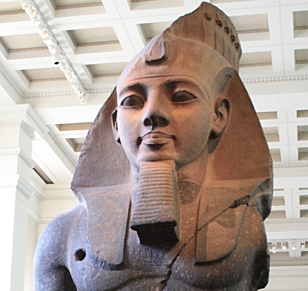 A photograph of the top half of a giant Ramses II statue
