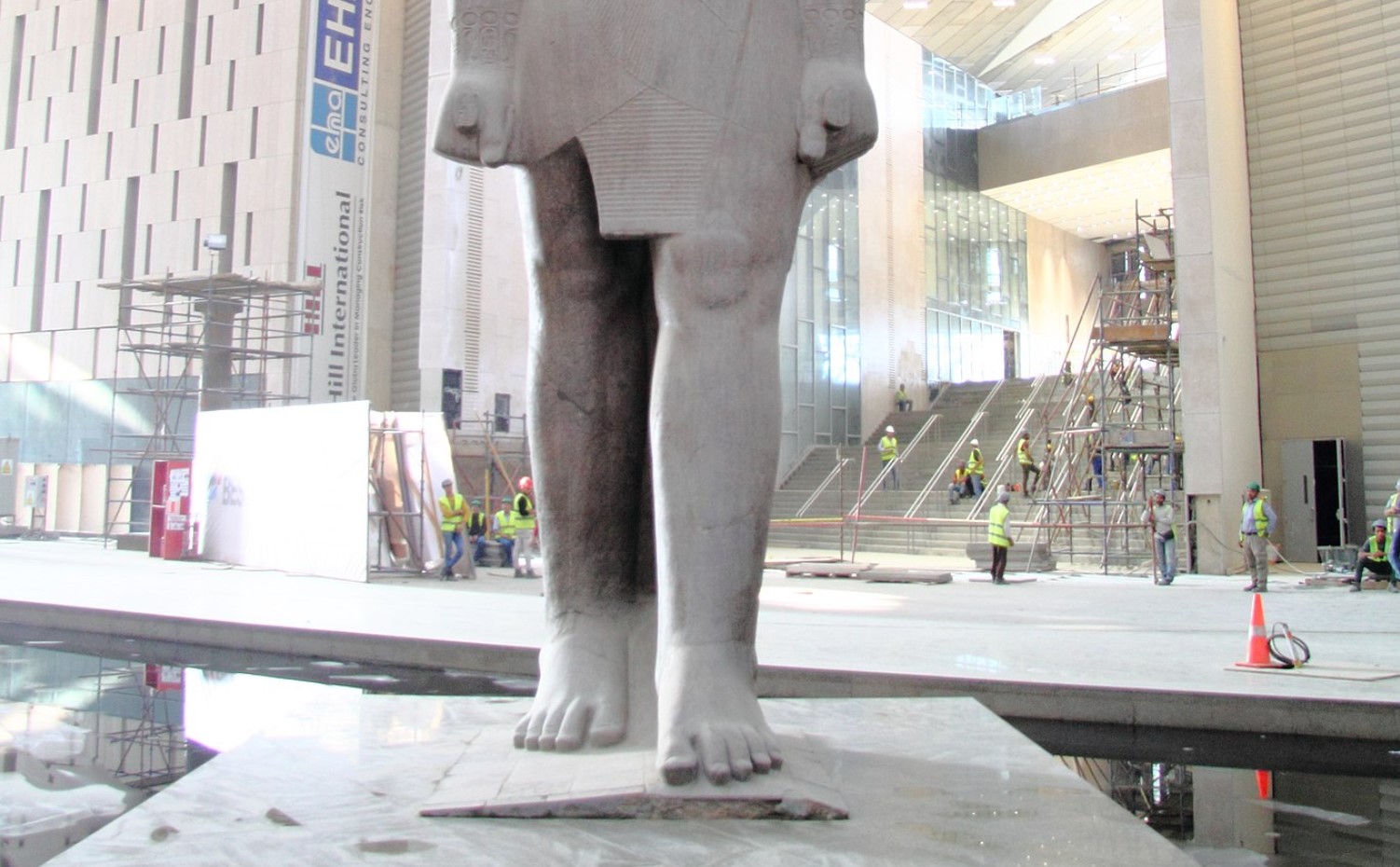 The bottom half of a statue of Ramses II picture on display in a museum
