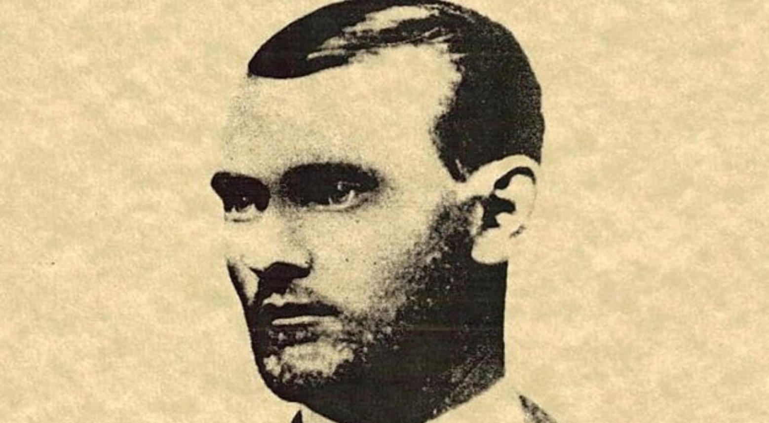 A wanted poster with Jesse James’ face on. It is printed in black and white and he is looking to the side.