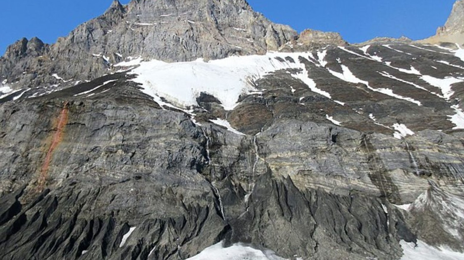 Spitsbergen Island. There are mountains with some snow on top.