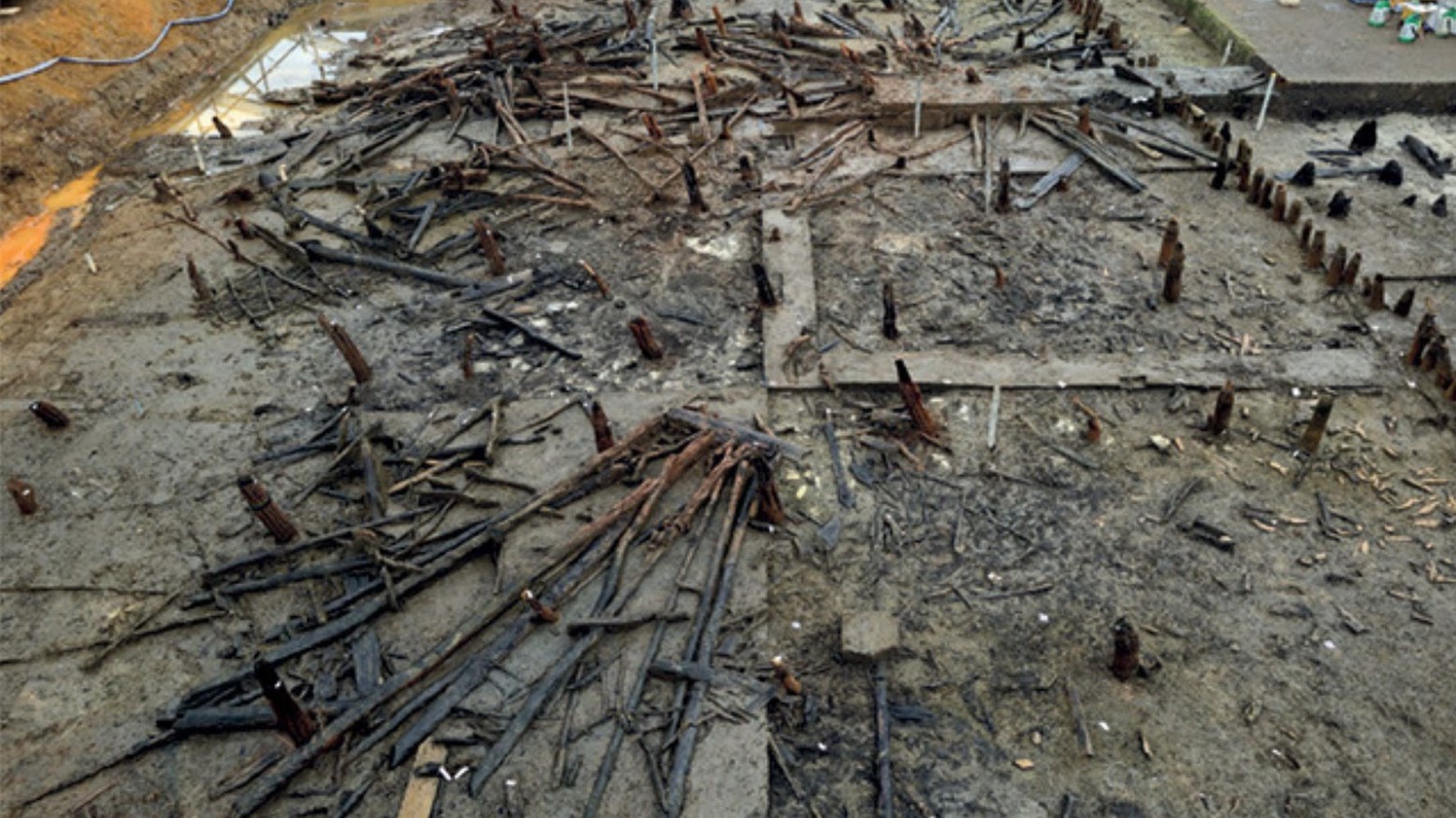 Uncovering the remains of the Must Farm pile-dwelling settlement; Structure 1 is visible in the foreground of the image