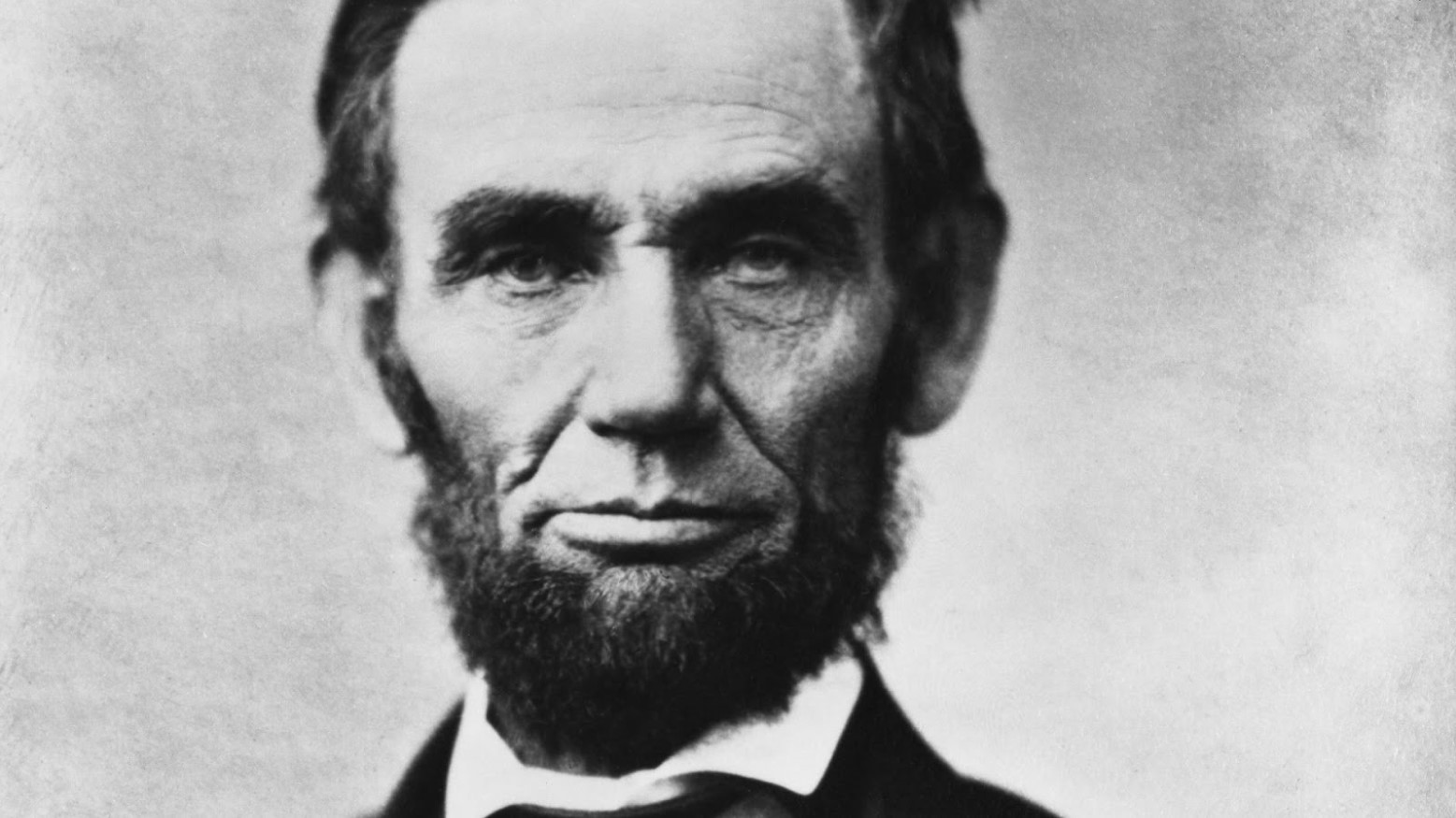 A black and white photograph of Abraham Lincoln.