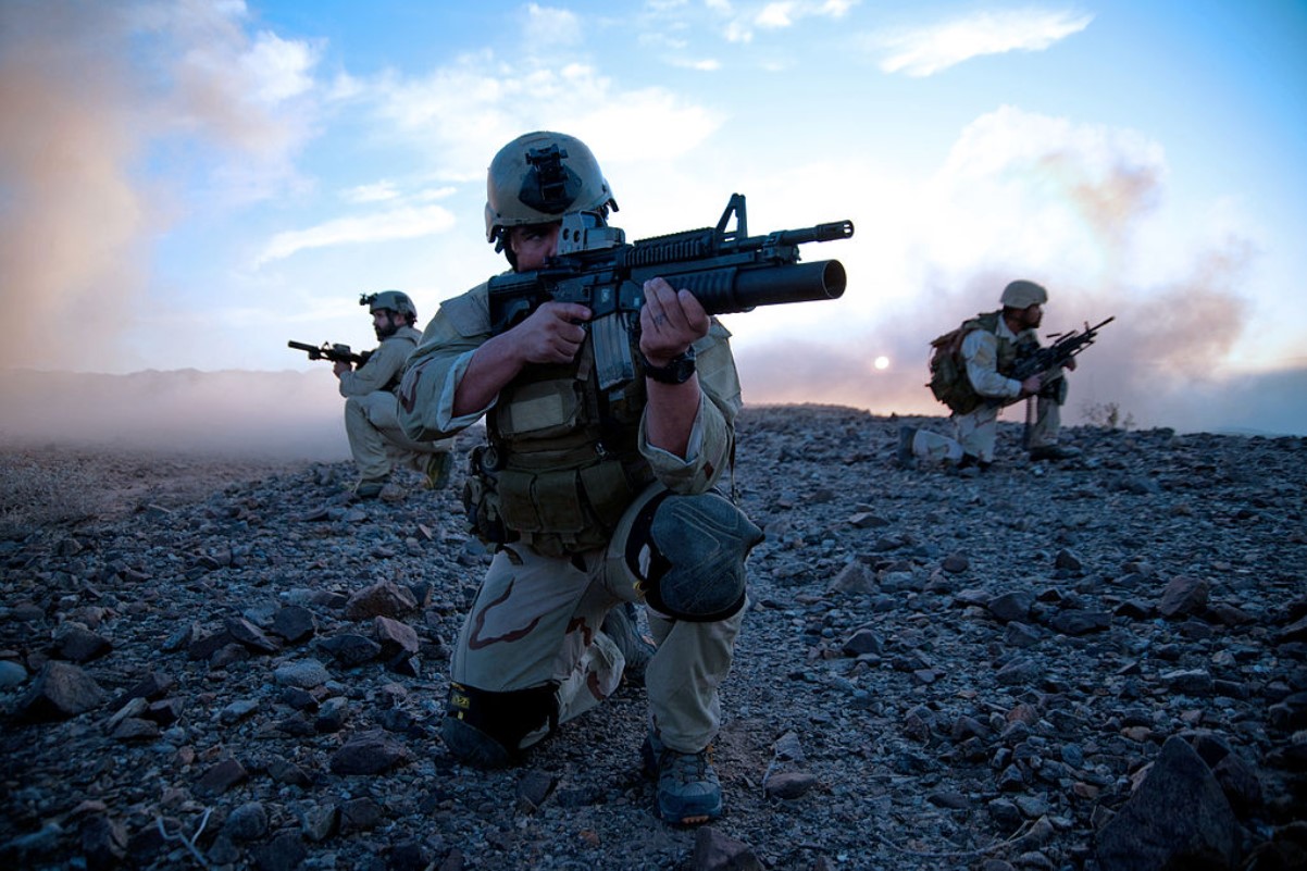 A US Navy Seal is pictured aiming down his sight while on tour