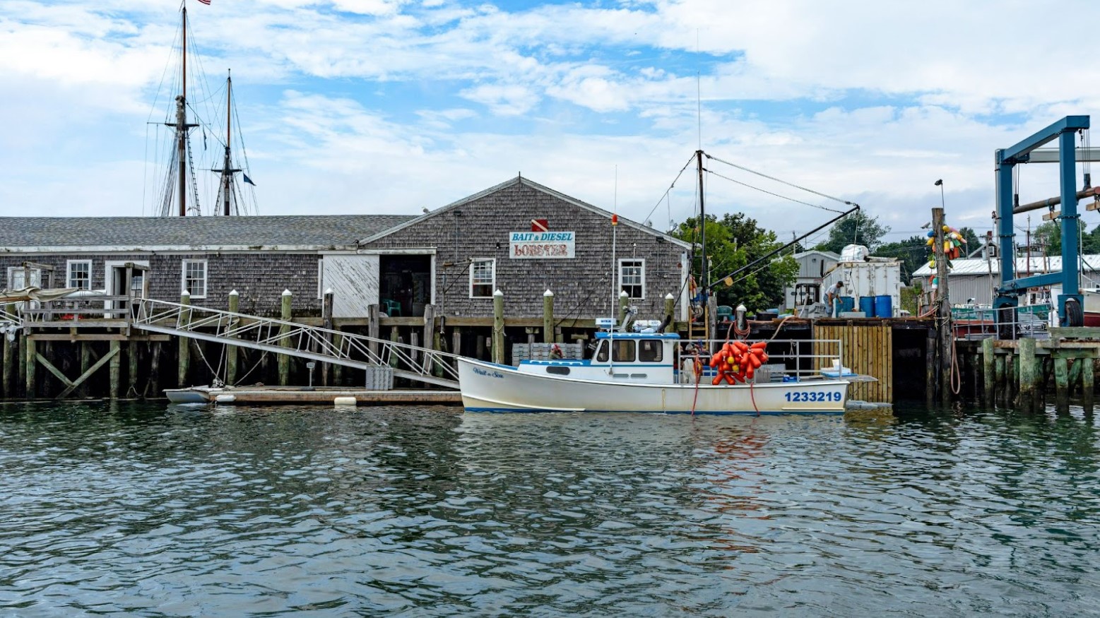 A boat and buildings seen in the daytime in Rockland, Maine.