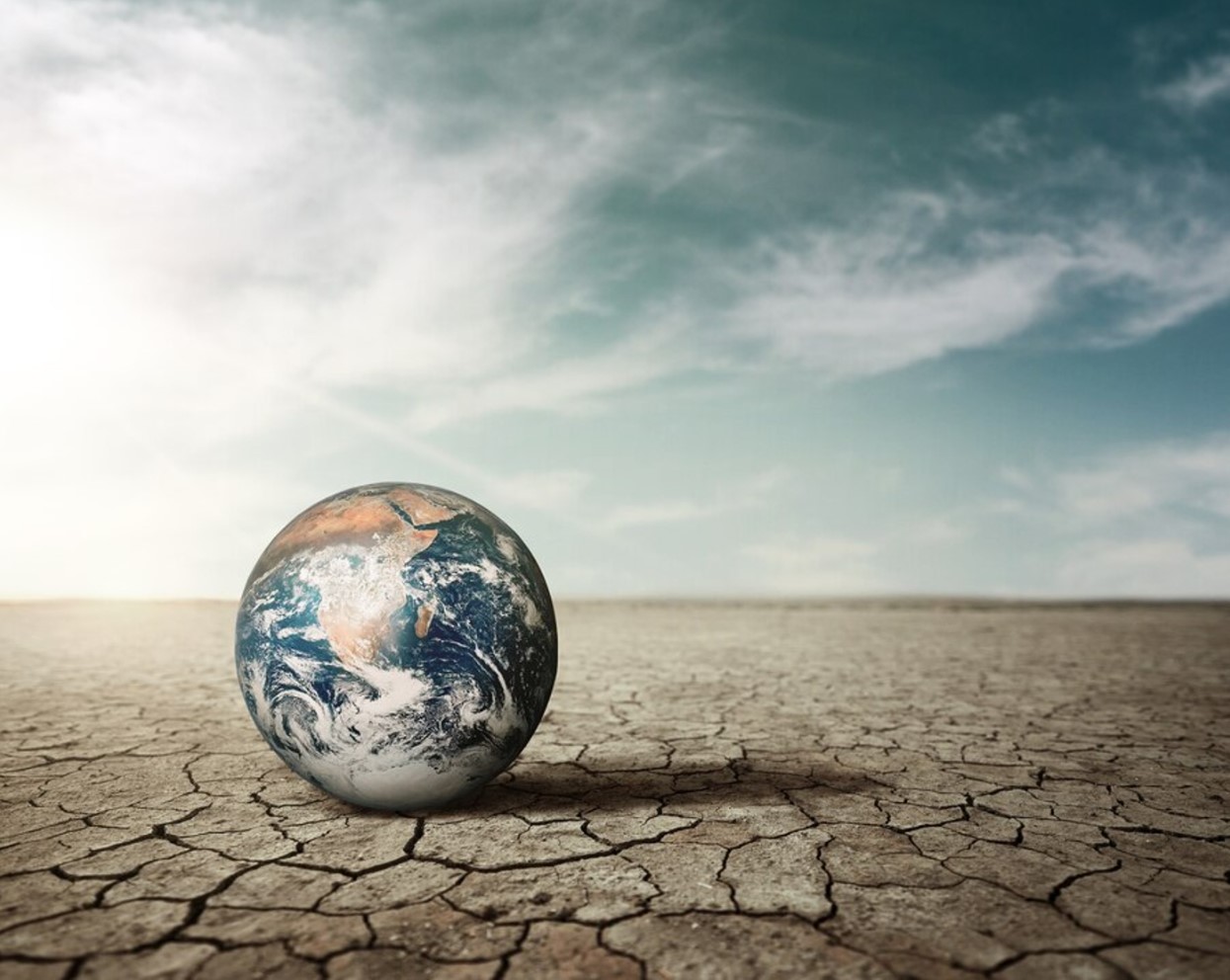 Digital illustration of the planet Earth on an empty desert destroyed from drought
