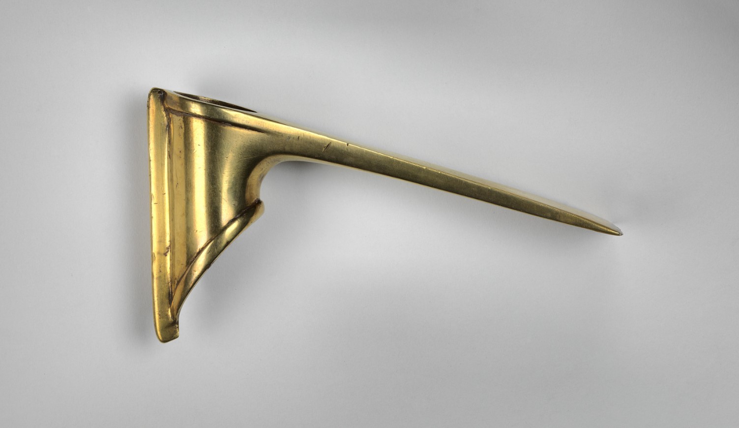 A small adze made from gold and silver unearthed from the cemetery at Ur