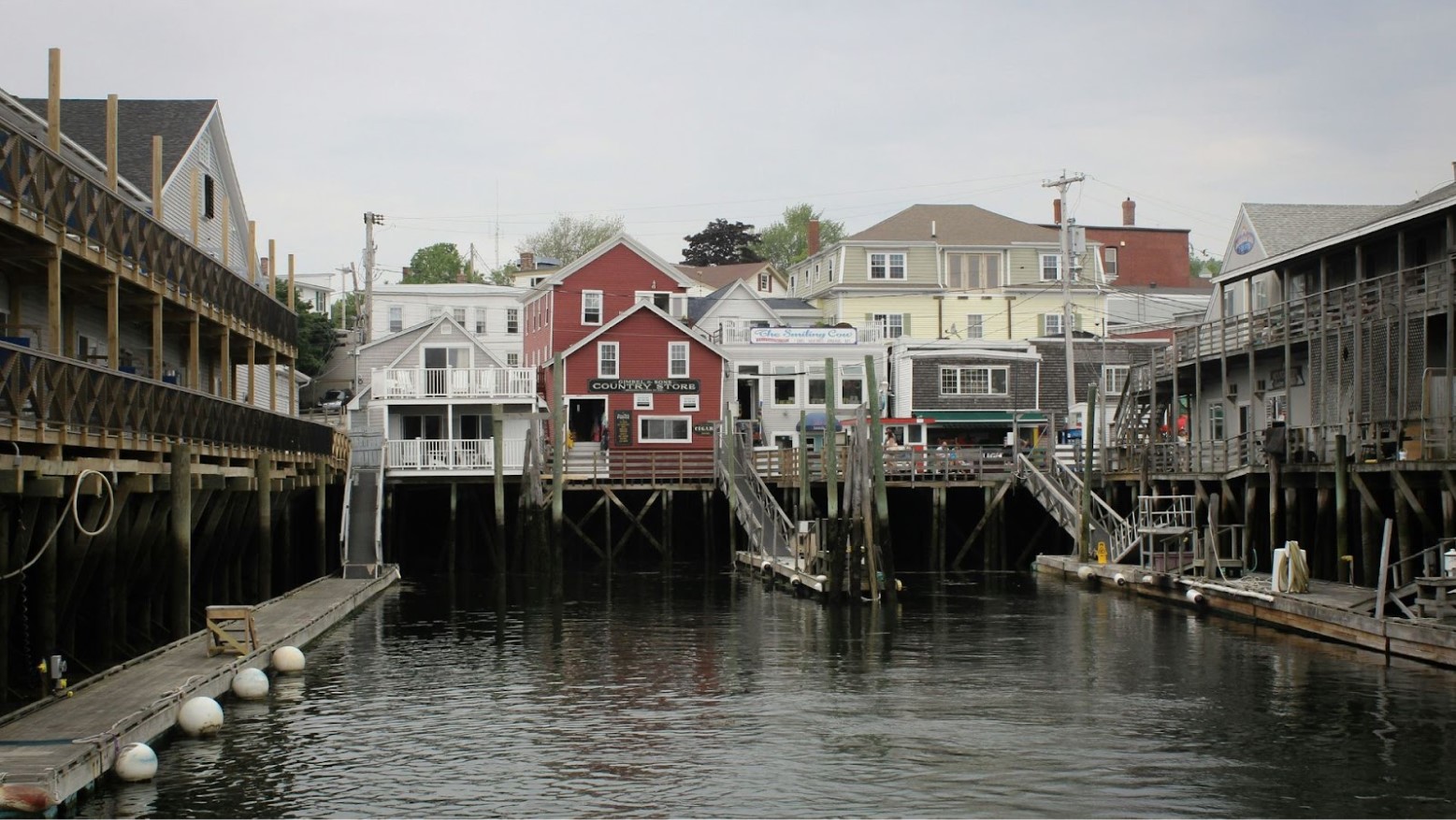Homes and buildings seen at a harbor in Portland, Maine.