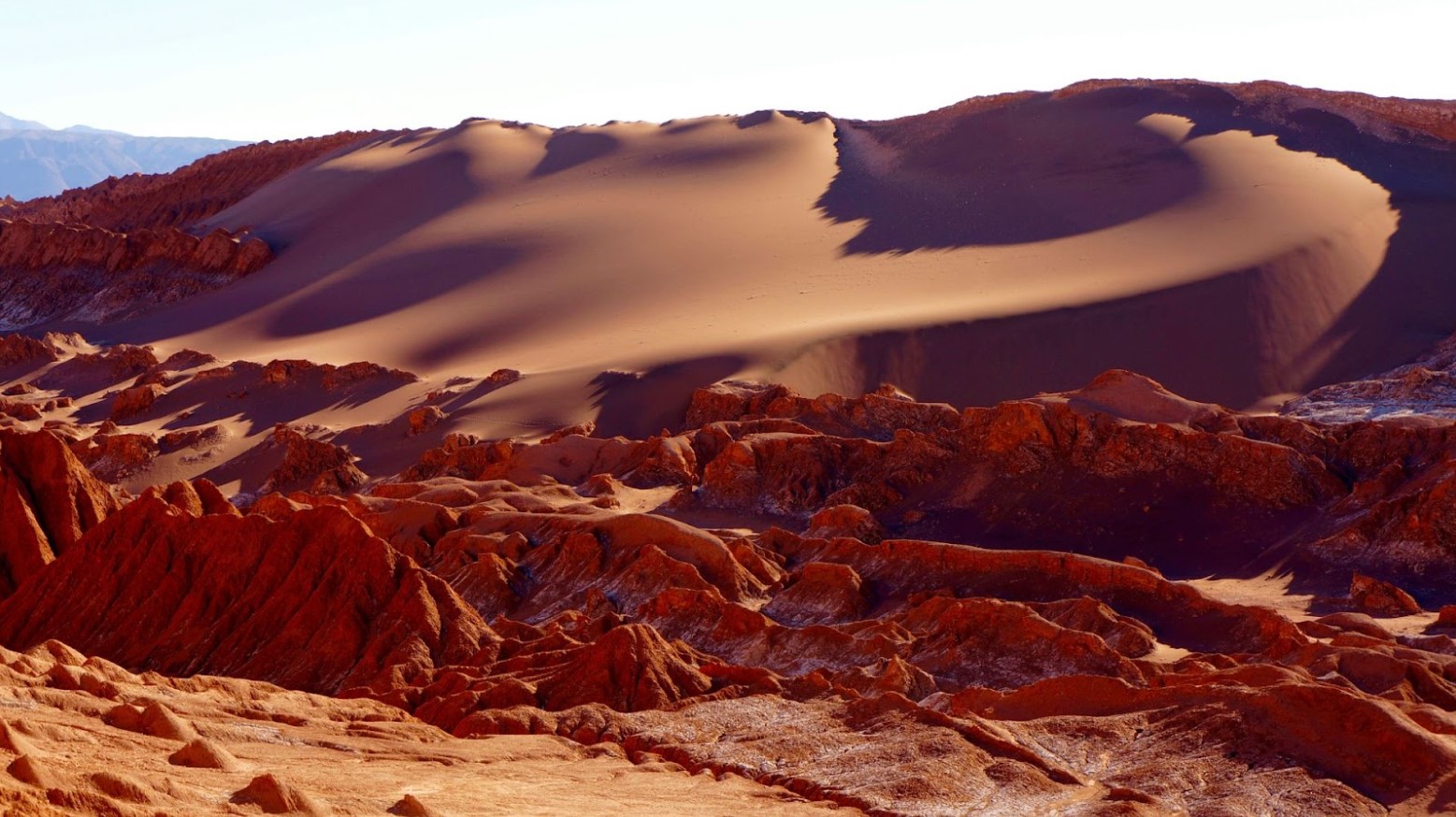 Rock formations and sand dunes seen in the Atacama Desert, Chile.
