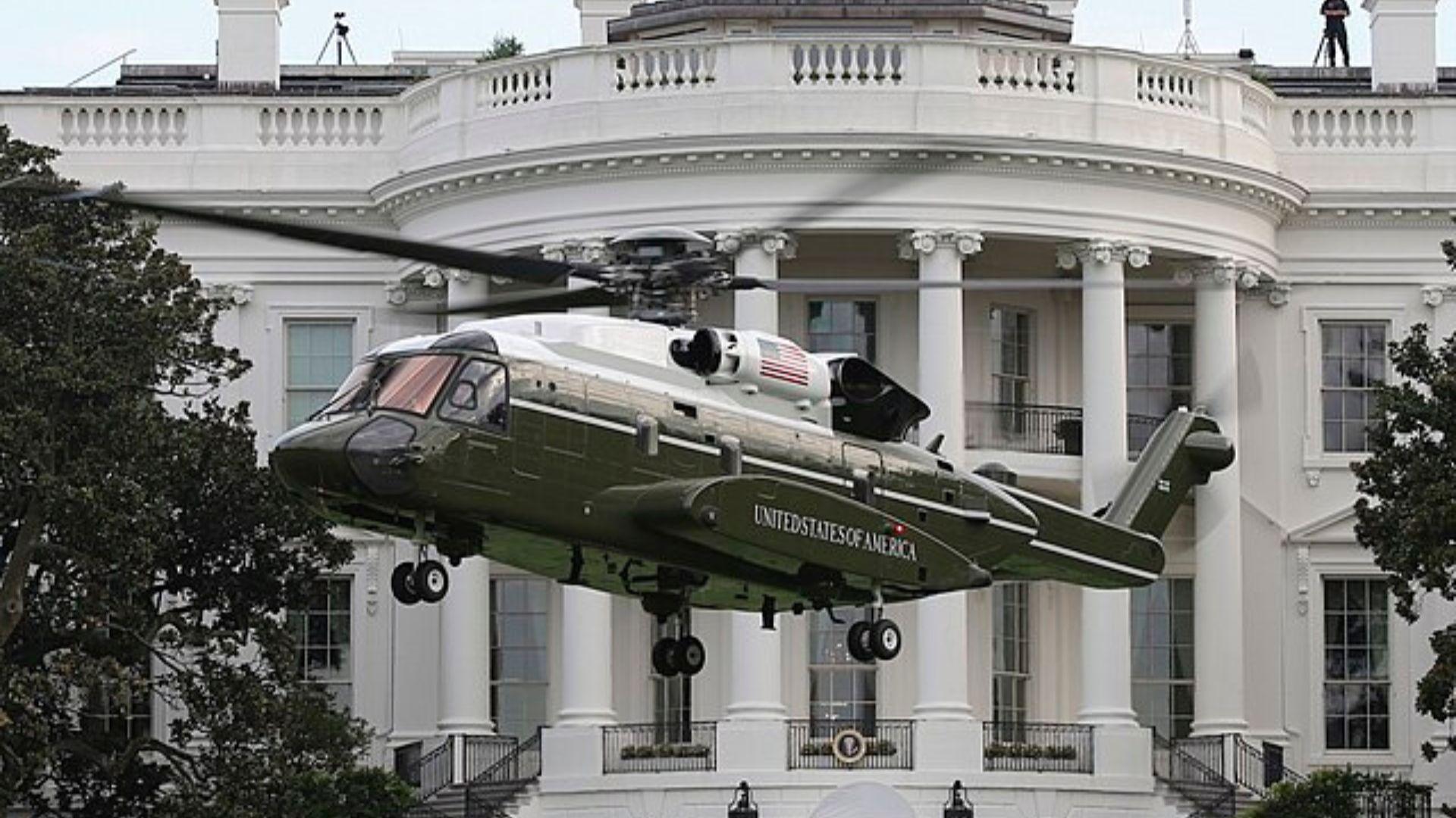 The VH-92 helicopter preparing to land on the lawn in front of the White House.