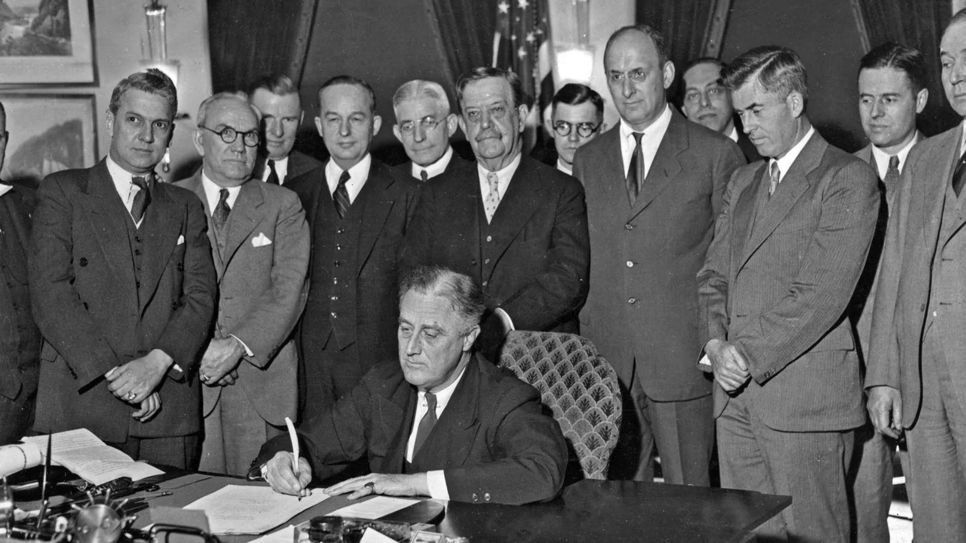 Then-president Franklin D. Roosevelt signing important legislation in the White House