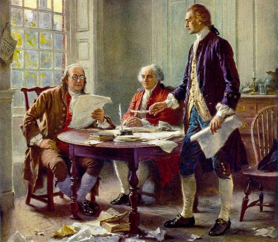Men pictured writing the Declaration of Independence on a small wooden table