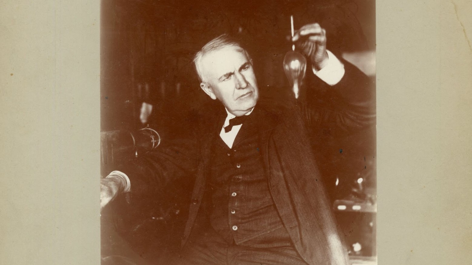 A 1905 photograph of Thomas Edison with a light bulb.