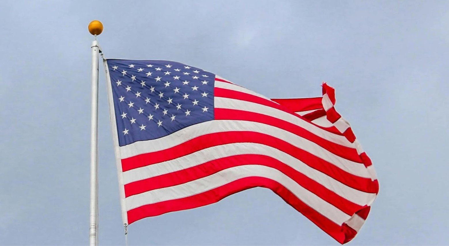 The US flag on a flagpole.