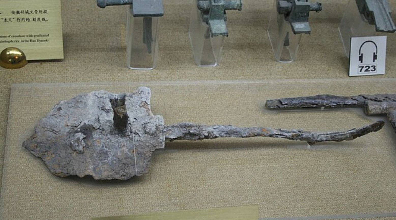 An ancient shield made of iron in a museum.