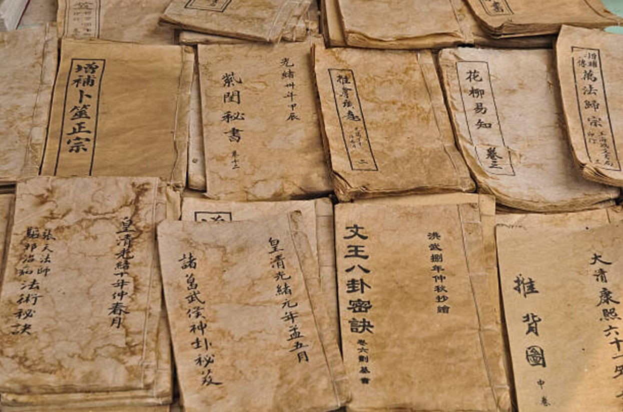 Stacks of old paper with Chinese text