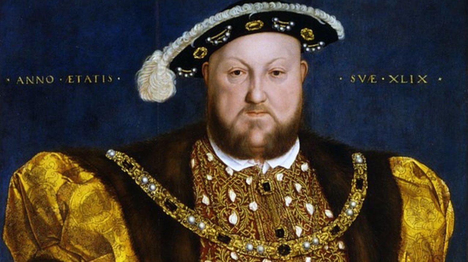 A painting of Henry VIII. He is wearing a black hat with white detailing and gold and brown clothes with a gold chain.