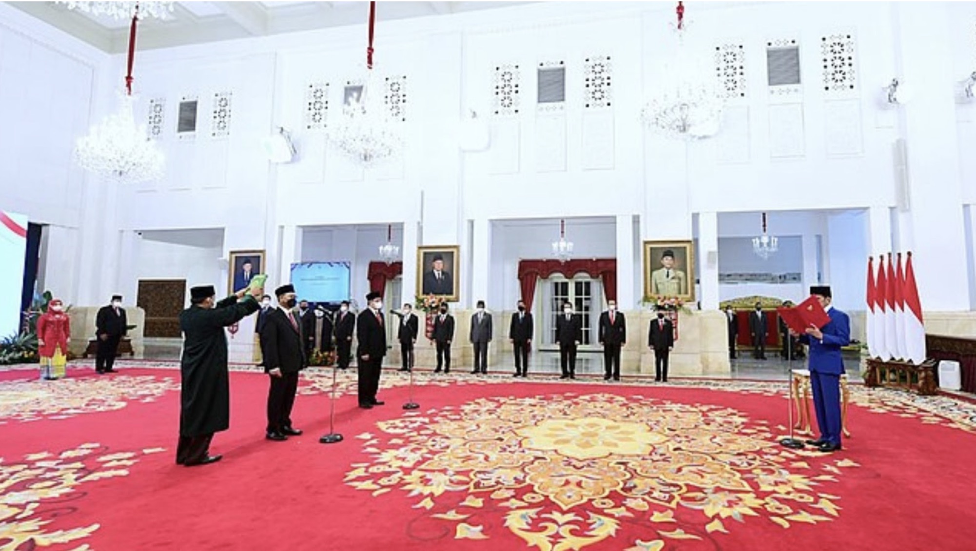 Indonesian government officials gathered in a room with a red carpet. The Nusantara government officials are being elected.