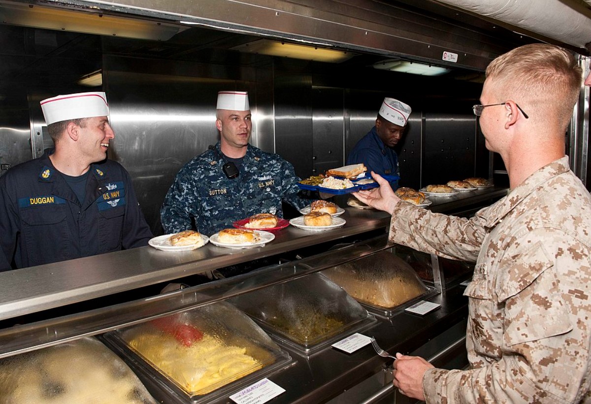 An image of a US Navy sailor ordering food in the gallery